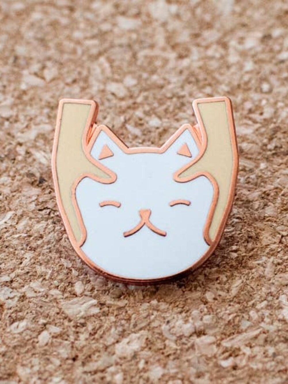White cat massage pin